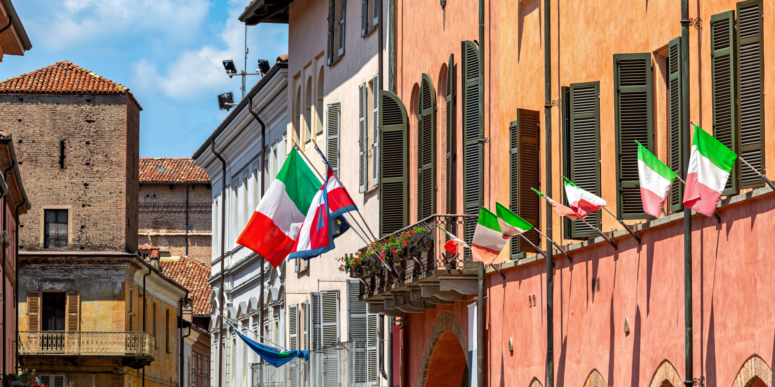 Colorful houses in Old Town of Alba, Italy.